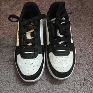 Black and white pumas kids size 1